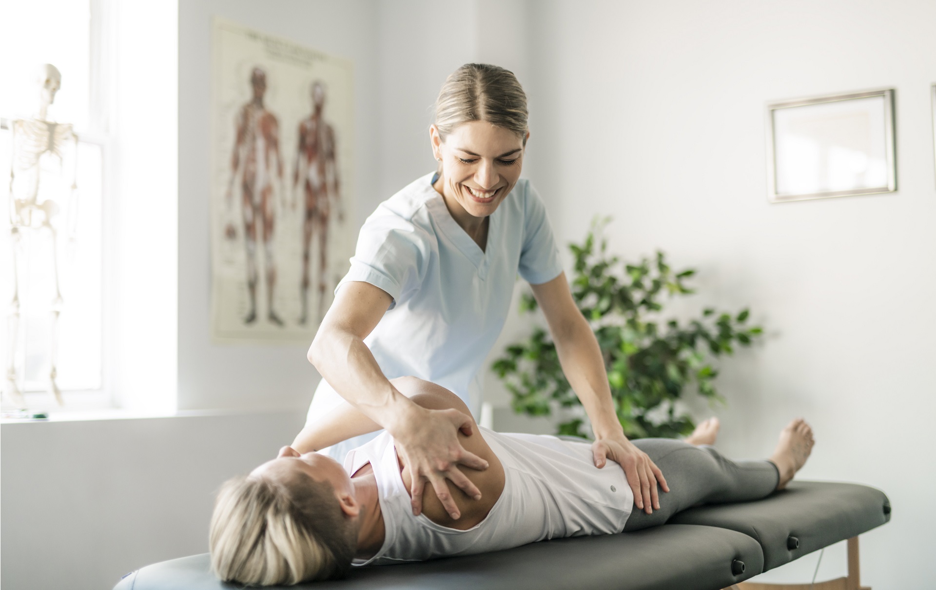 A Modern rehabilitation physiotherapy worker with woman client