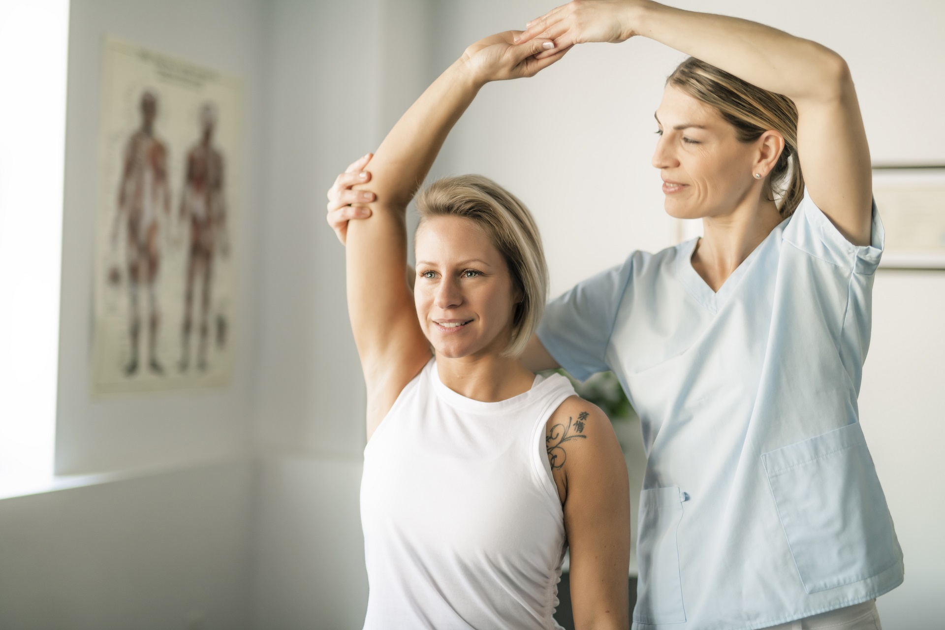A Modern rehabilitation physiotherapy worker with woman client