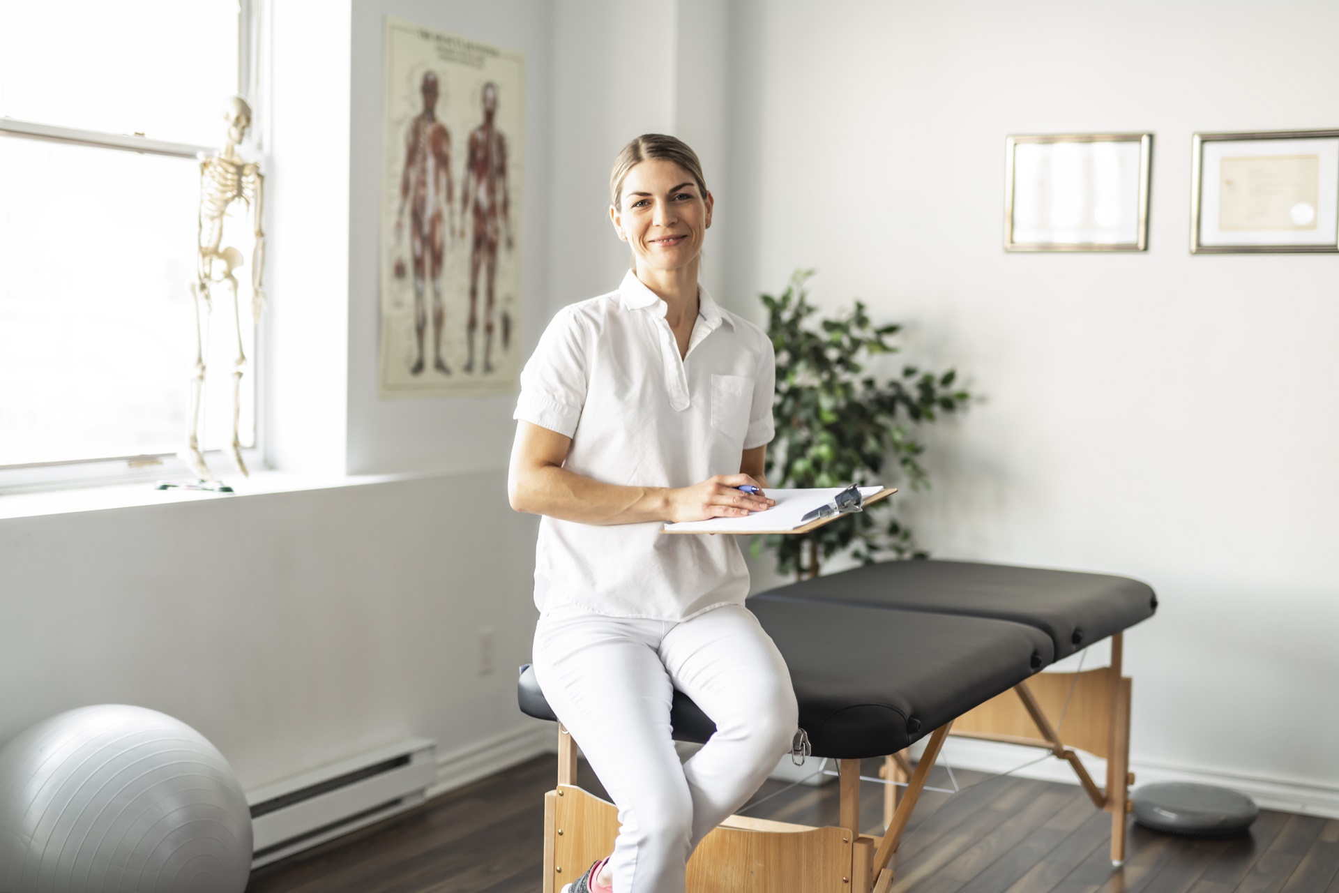 A Modern rehabilitation physiotherapy woman worker at job